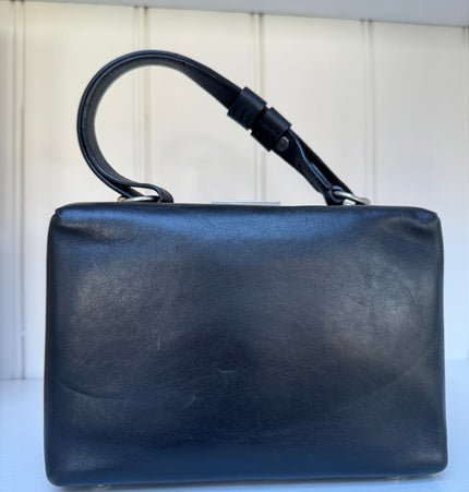 Prada top handle kiss lock handbag