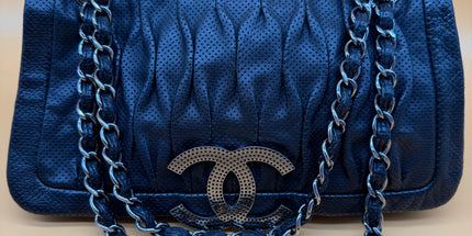 Chanel crossbody perforated flap bag