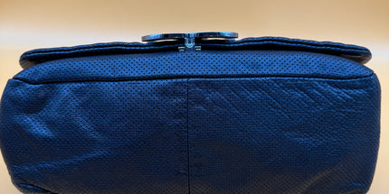 Chanel crossbody perforated flap bag