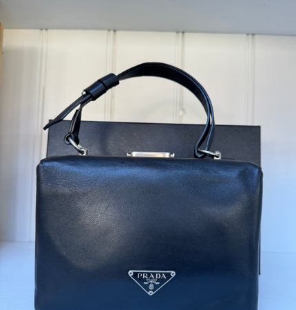 Prada top handle kiss lock handbag