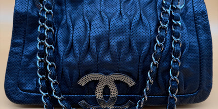Chanel crossbody perforated flap bag