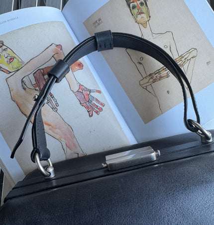 Prada top handle kiss lock handbag