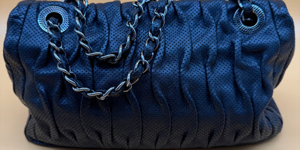 Chanel crossbody perforated flap bag