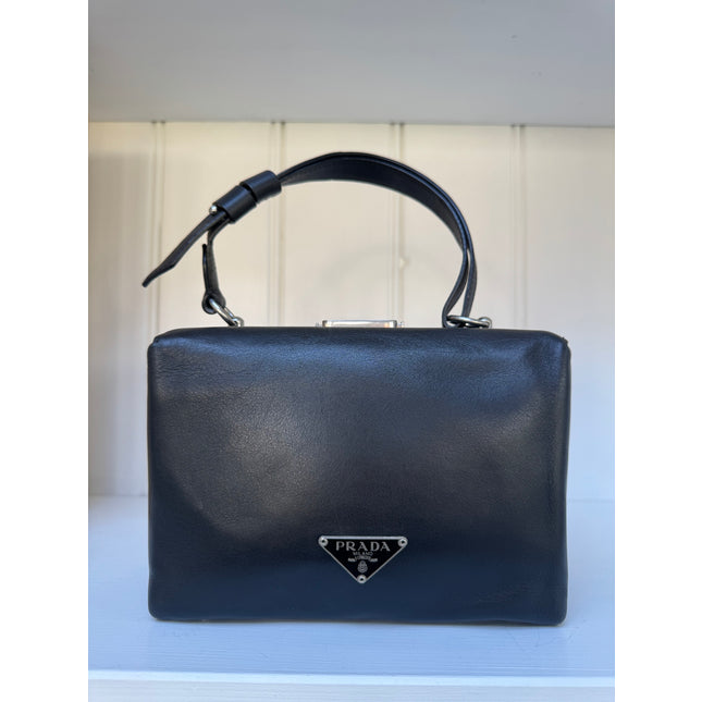 Prada top handle kiss lock handbag