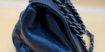 Chanel crossbody perforated flap bag