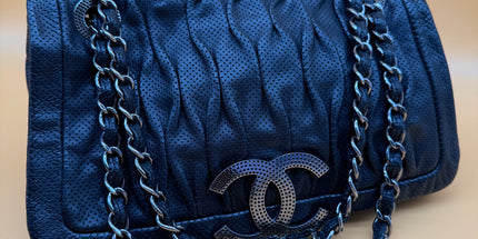 Chanel crossbody perforated flap bag