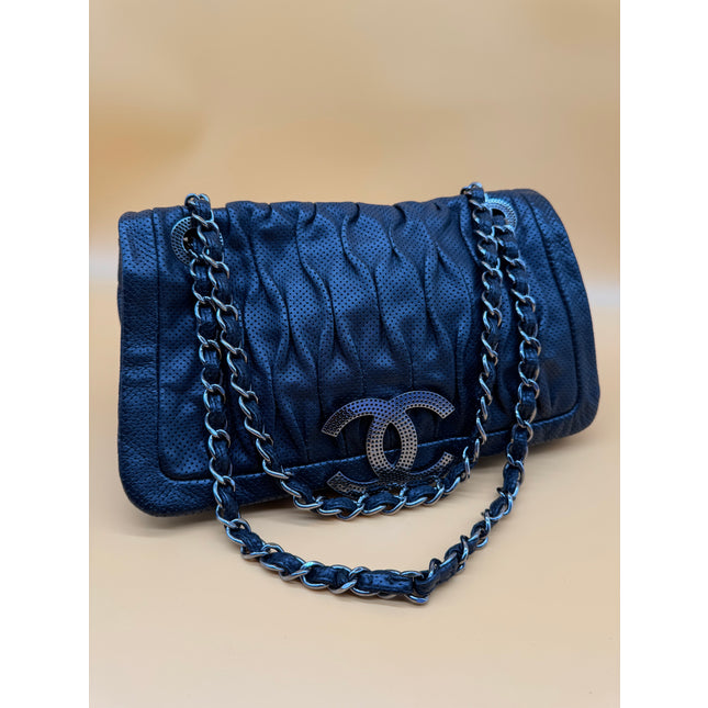Chanel crossbody perforated flap bag