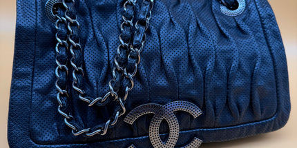 Chanel crossbody perforated flap bag