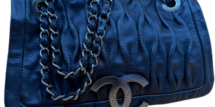 Chanel crossbody perforated flap bag