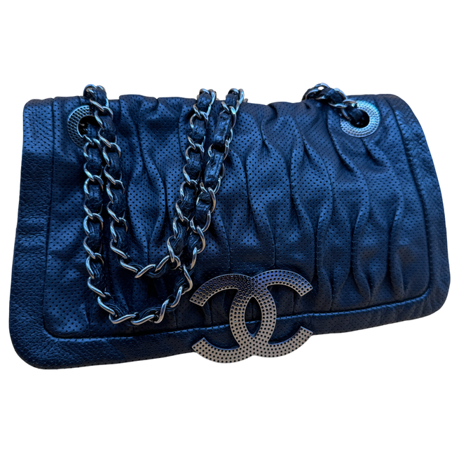 Chanel crossbody perforated flap bag
