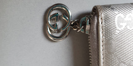 Gucci silver coated canvas wallet